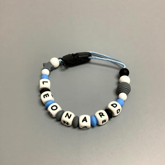 Attache-suce bleu et gris avec nom Léonard