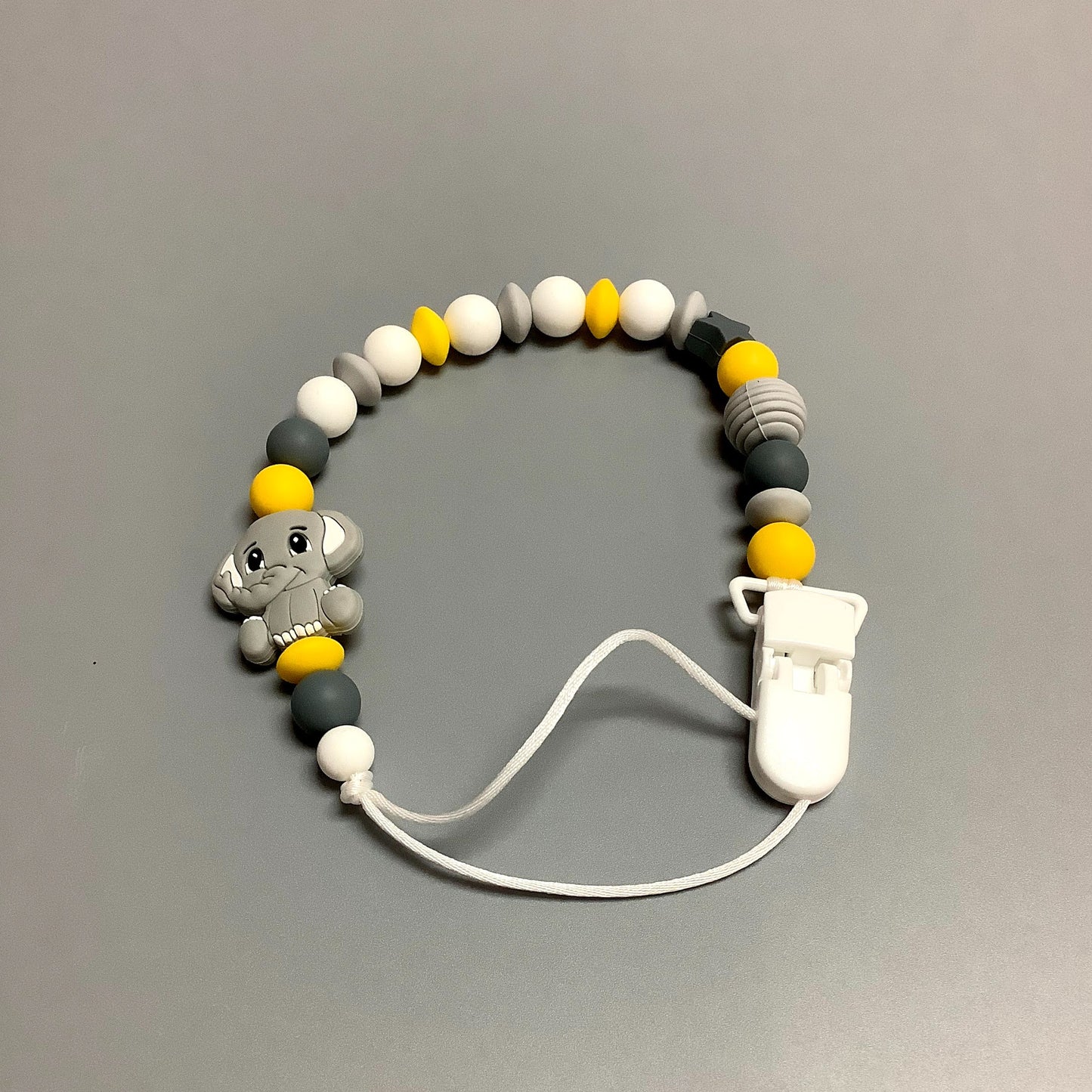 Attache-suce en silicone - Éléphant gris avec billes jaunes
