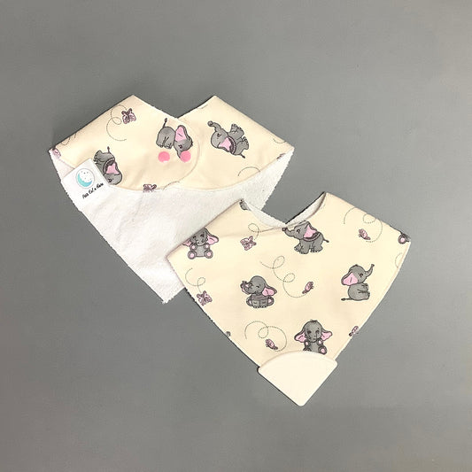 Pink elephant teething bib on beige background
