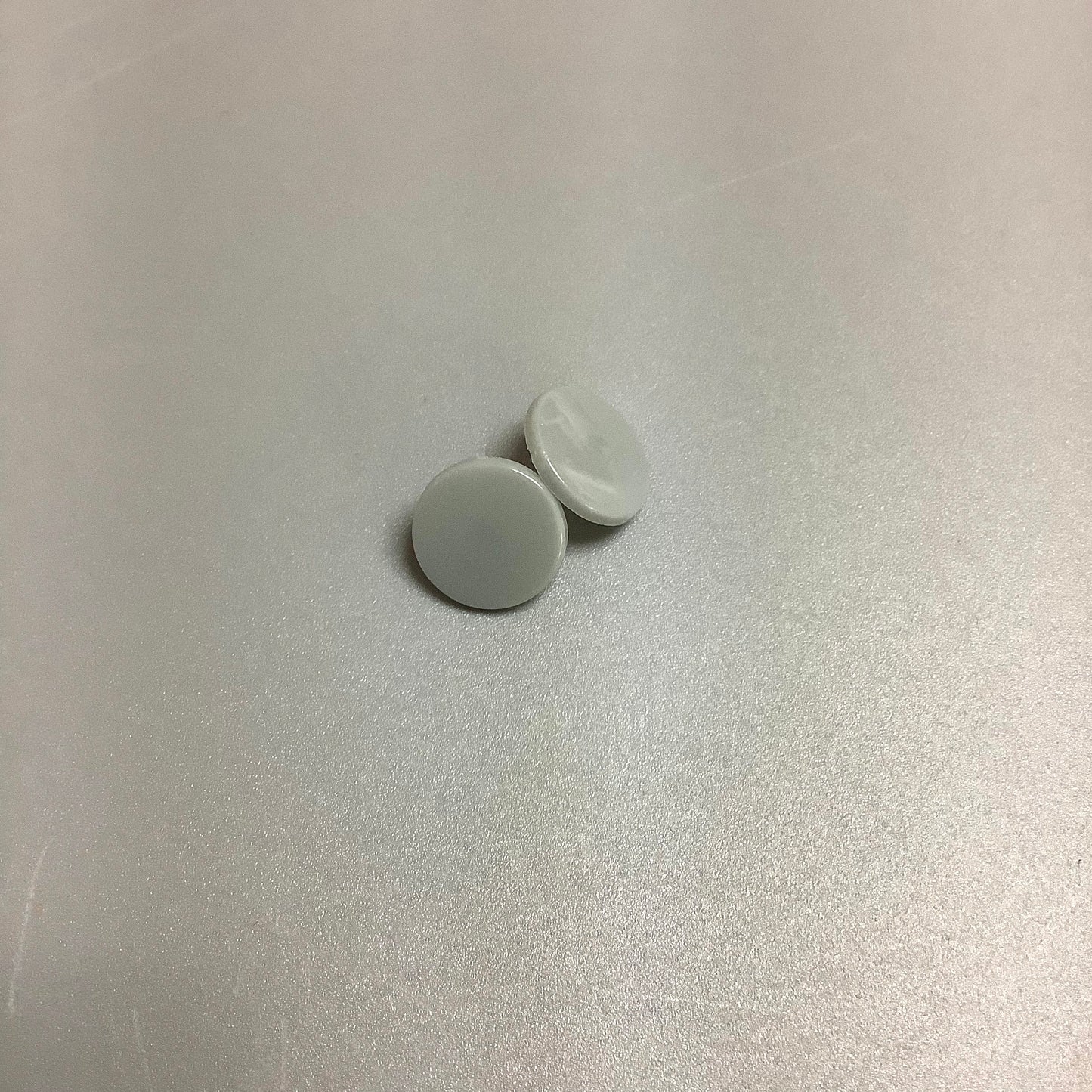 Blue elephant teething bib on beige background